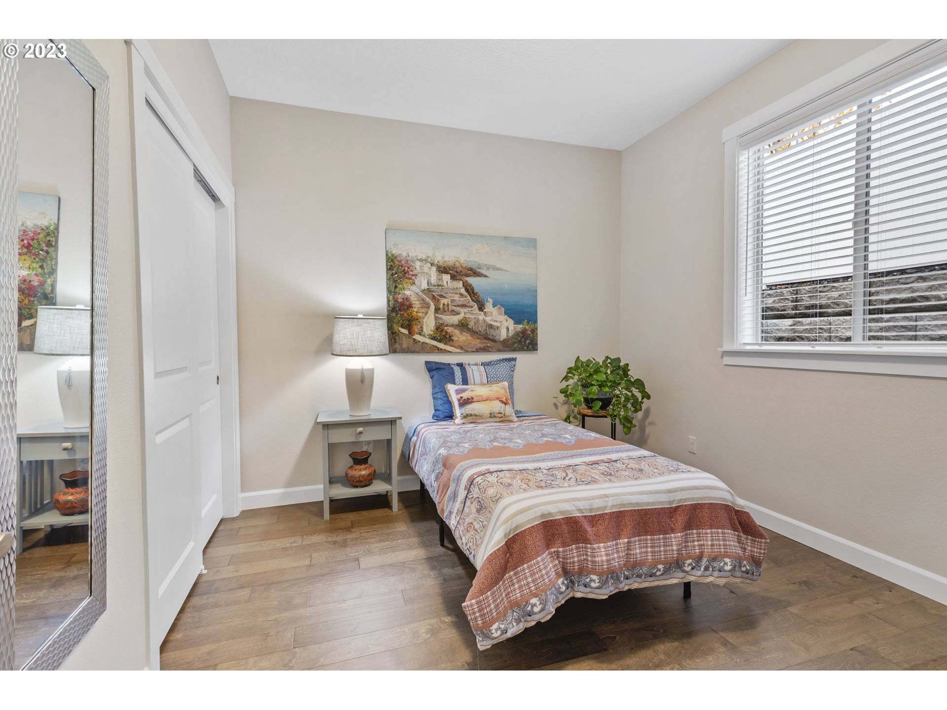 17402 Northeast 16th Avenue Ridgefield, WA 98642 - Photo 27 of 32 a bedroom with a bed wall painting and a window