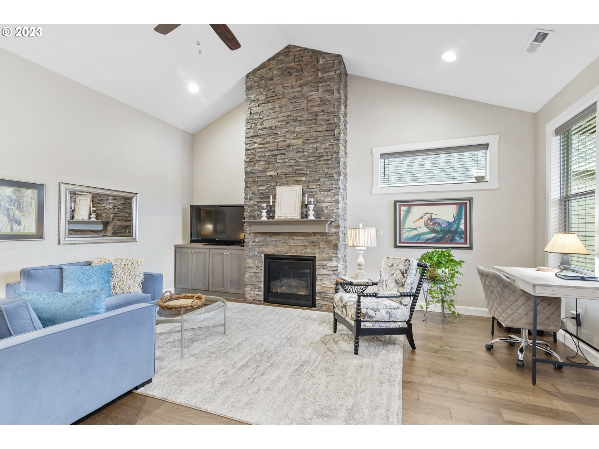 17402 Northeast 16th Avenue Ridgefield, WA 98642 - Photo 4 of 32 a living room with furniture and a fireplace