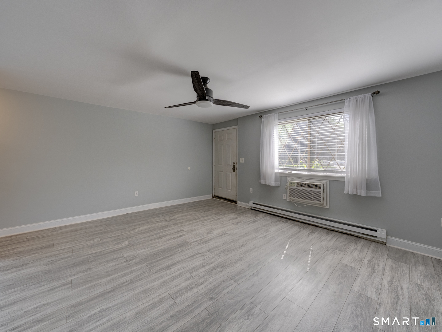 2 Branch Road, Unit 2C Thomaston, CT 06787 - Photo 4 of 26 a view of an empty room with a window