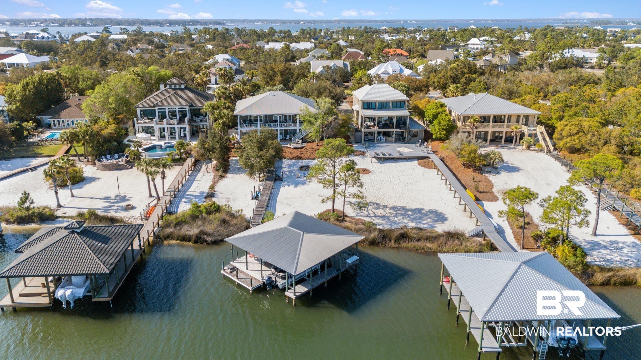 30818 River Road Orange Beach, AL 36561 - Photo 74 of 81 Aerial view of residential area featuring a large body of water