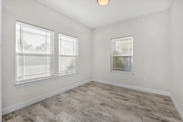 a view of an empty room with a window