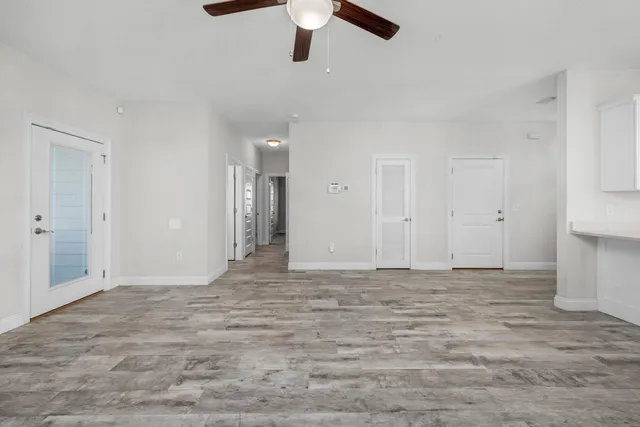 a view of empty room with ceiling fan