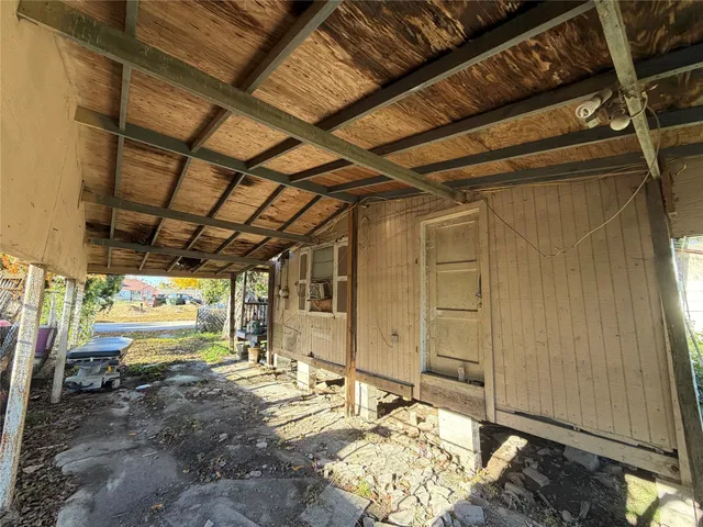 a view of a room with wooden walls