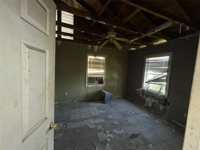 a view of an empty room with a fireplace