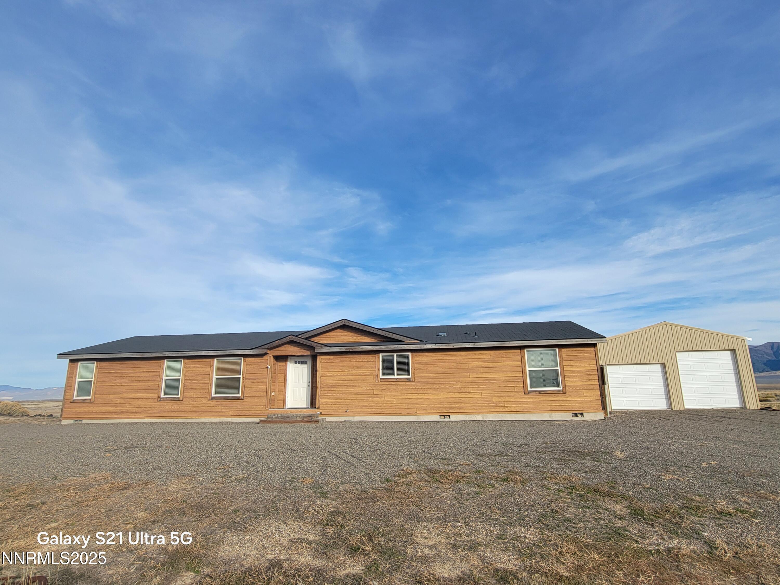 6650 Antelope Circle Austin, NV 89310 - Photo 1 of 25 a front view of a house with a yard
