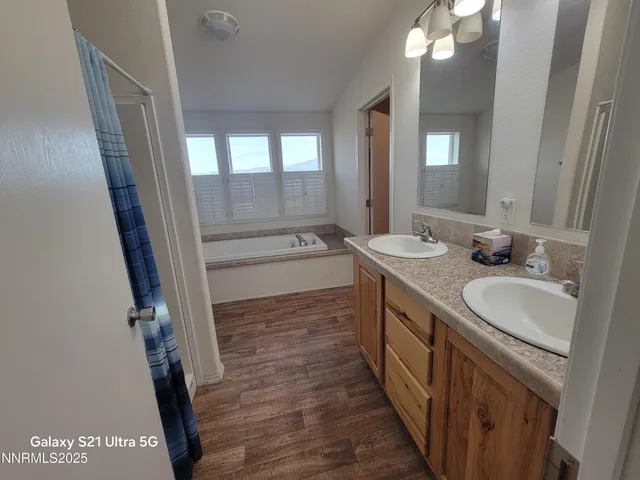 a bathroom with a sink a vanity and a mirror