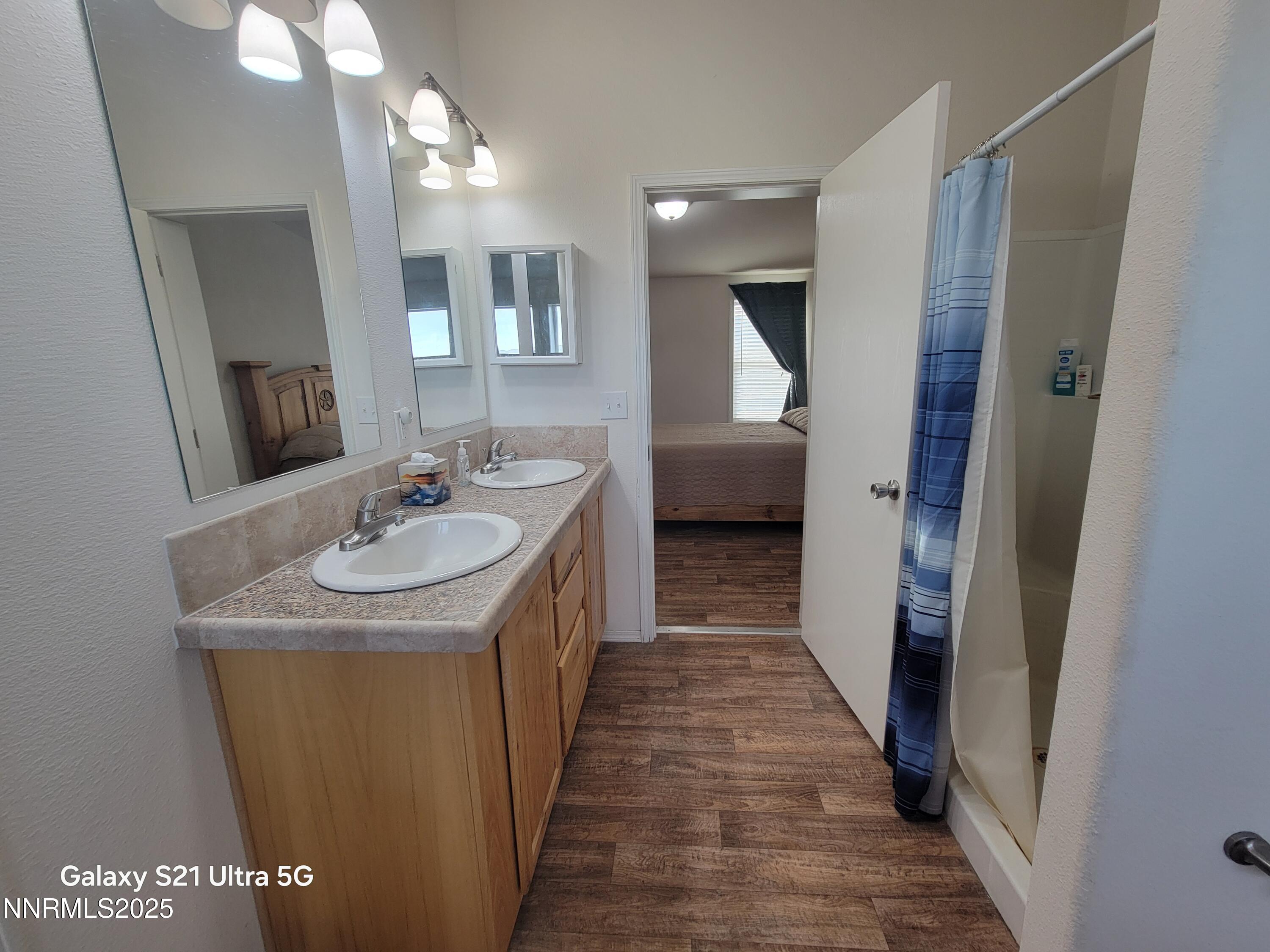6650 Antelope Circle Austin, NV 89310 - Photo 15 of 25 a en suite bathroom with a sink and mirror