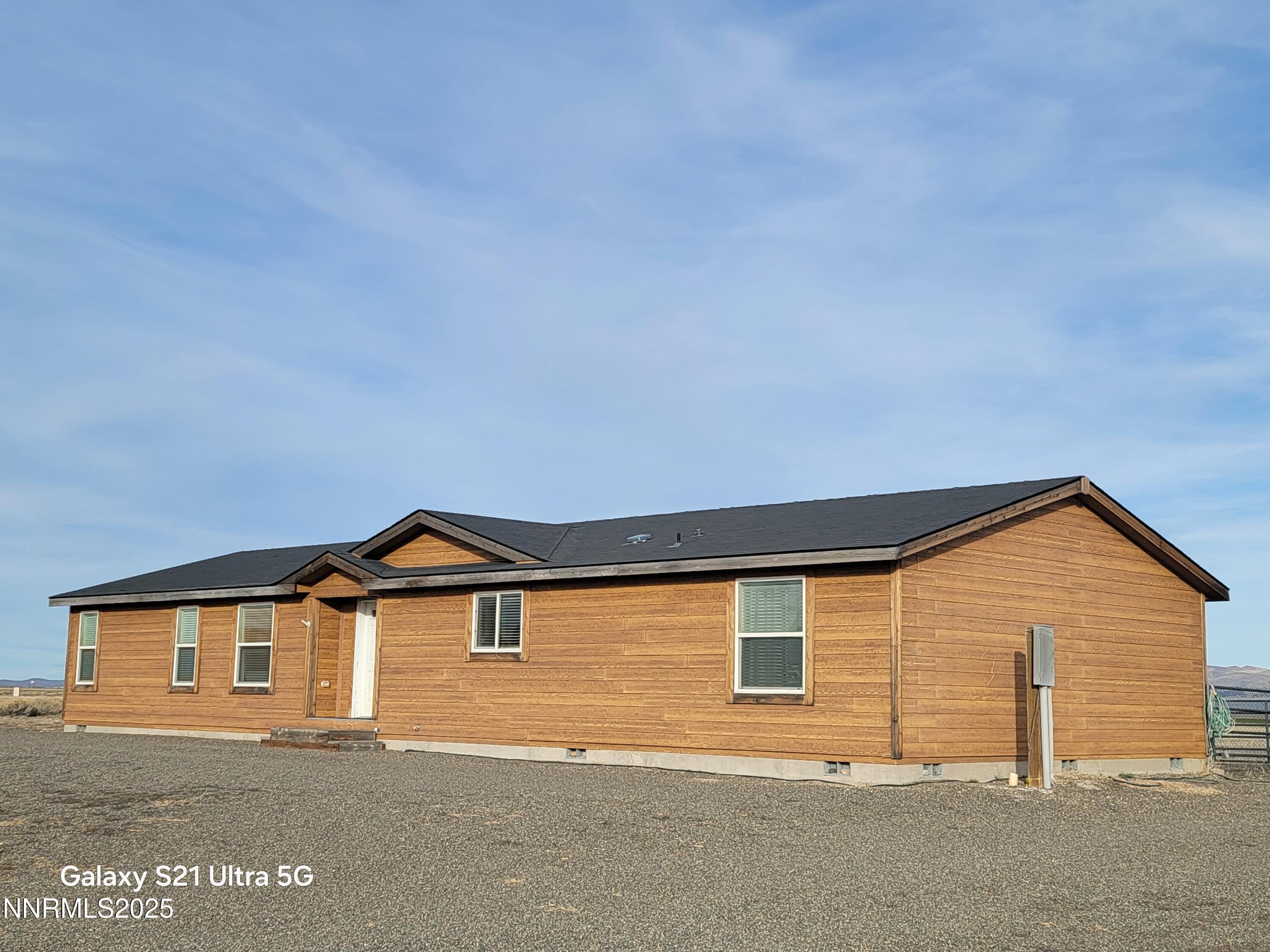 6650 Antelope Circle Austin, NV 89310 - Photo 3 of 25 a view of a house with wooden fence