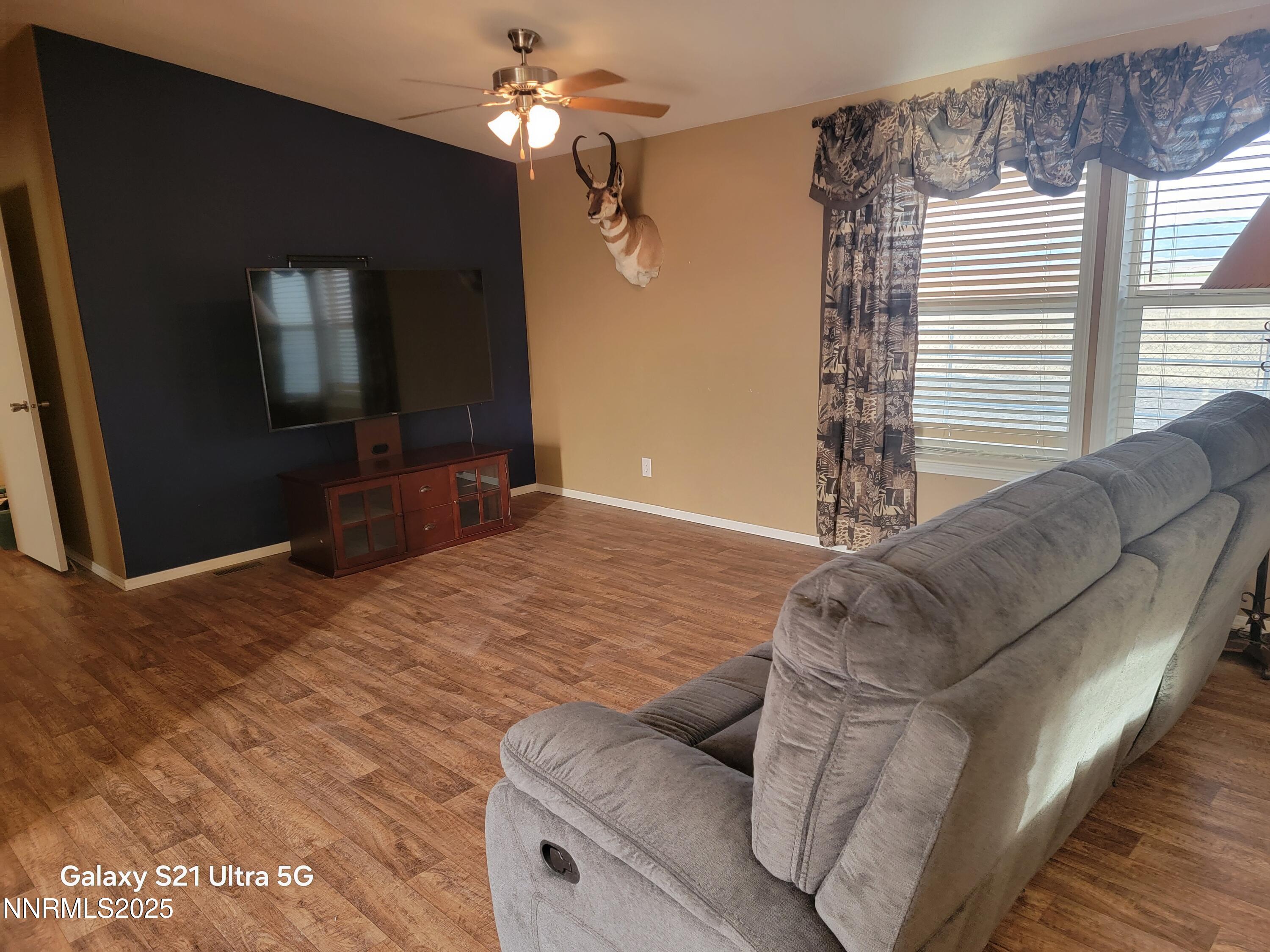 6650 Antelope Circle Austin, NV 89310 - Photo 4 of 25 a living room with furniture and a flat screen tv