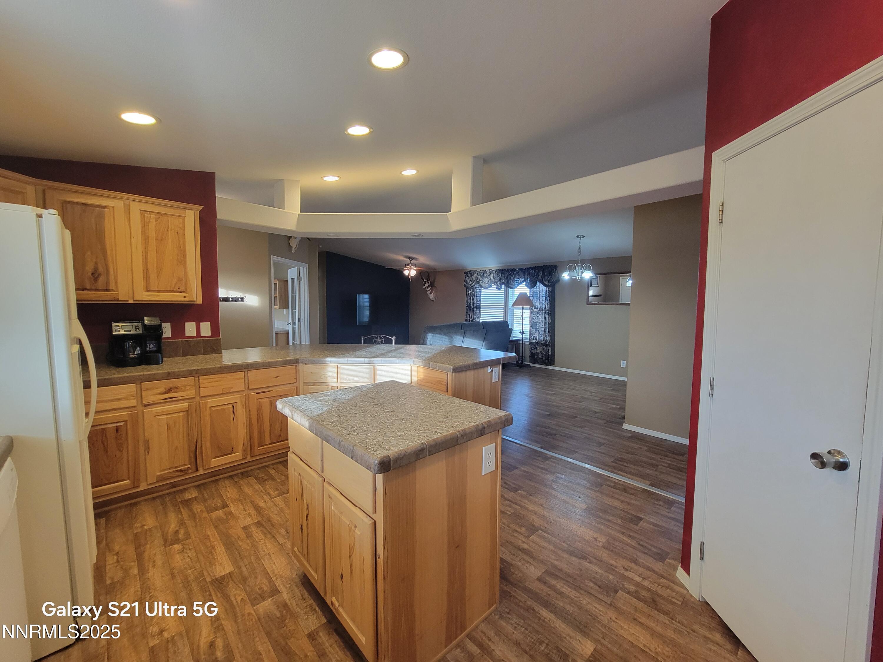 6650 Antelope Circle Austin, NV 89310 - Photo 8 of 25 a kitchen with stainless steel appliances granite countertop a sink stove and wooden cabinets