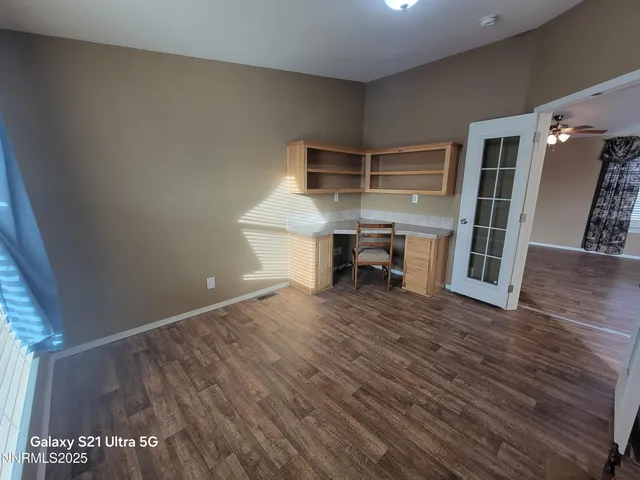 a view of a livingroom with furniture and wooden floor