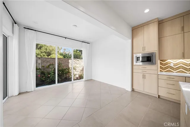 a front view of a house with a yard and flowers