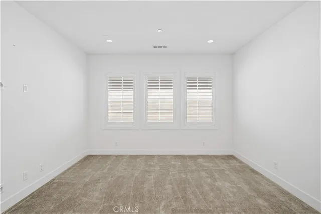 an empty room with a sliding door