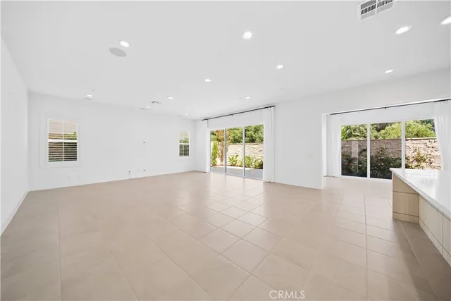 a view of an empty room with windows