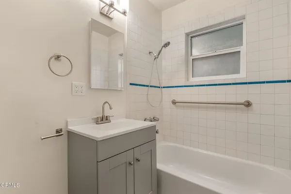 a bathroom with a sink a vanity and a mirror