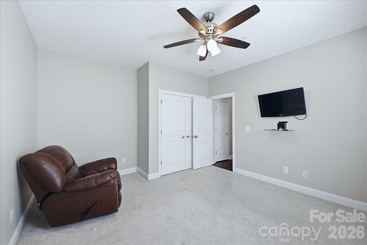 1825 Laveta Road Charlotte, NC 28269 - Photo 25 of 48 a living room with furniture and a flat screen tv