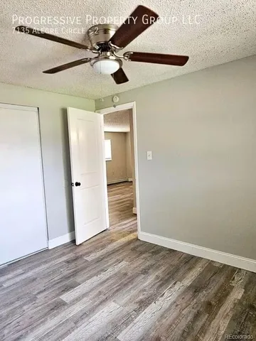 a kitchen with cabinets appliances a sink and a stove