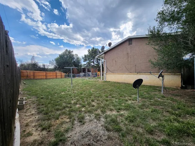 a backyard of a house with lots of green space