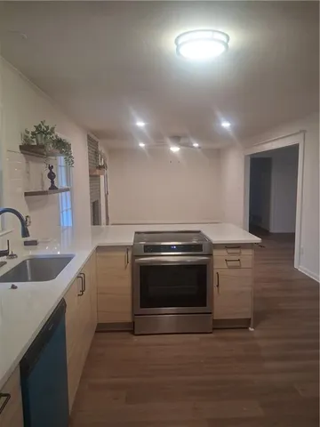 a kitchen with a stove and a sink