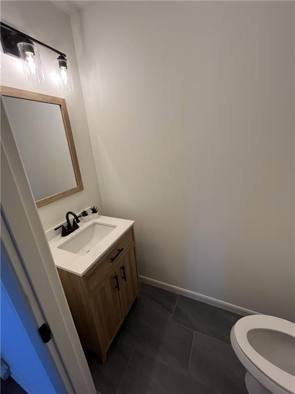 3425 New MacLand Road Powder Springs, GA 30127 - Photo 12 of 21 a bathroom with a sink vanity and a toilet