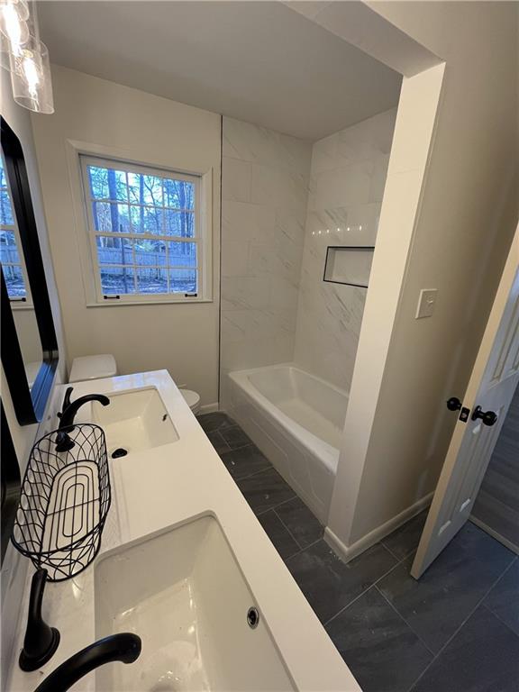 3425 New MacLand Road Powder Springs, GA 30127 - Photo 14 of 21 a bathroom with a sink and a bathtub