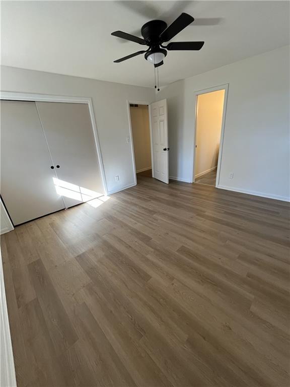 3425 New MacLand Road Powder Springs, GA 30127 - Photo 18 of 21 a view of empty room with wooden floor and ceiling fan
