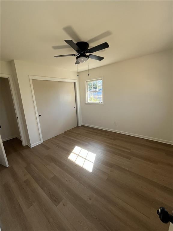 3425 New MacLand Road Powder Springs, GA 30127 - Photo 20 of 21 an empty room with wooden floor fan and windows