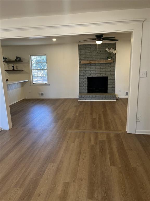 3425 New MacLand Road Powder Springs, GA 30127 - Photo 2 of 21 a view of an empty room with a fireplace and a window
