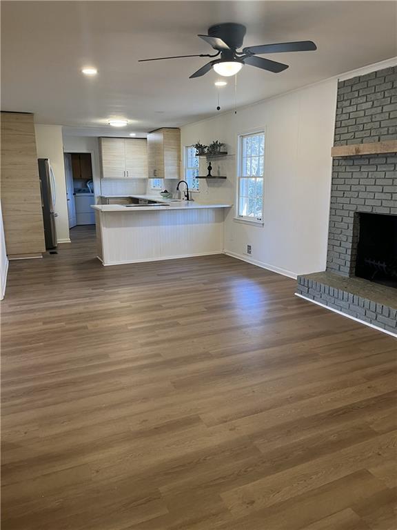 3425 New MacLand Road Powder Springs, GA 30127 - Photo 5 of 21 a view of kitchen with granite countertop cabinets and wooden floor
