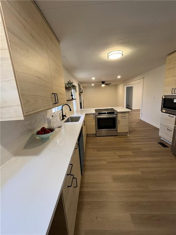 3425 New MacLand Road Powder Springs, GA 30127 - Photo 8 of 21 a kitchen with kitchen island a sink counter top space and appliances