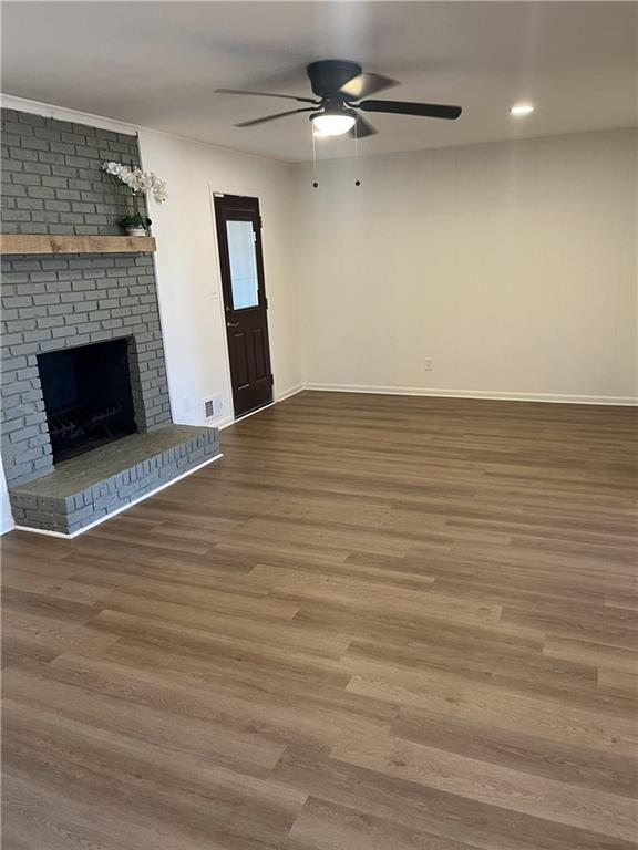 3425 New MacLand Road Powder Springs, GA 30127 - Photo 10 of 21 a view of a livingroom with wooden floor and a fireplace