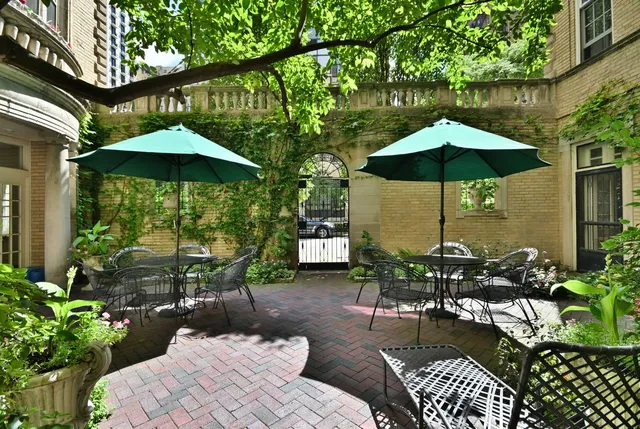 a view of a balcony with chairs