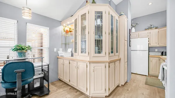a kitchen with a sink and a refrigerator