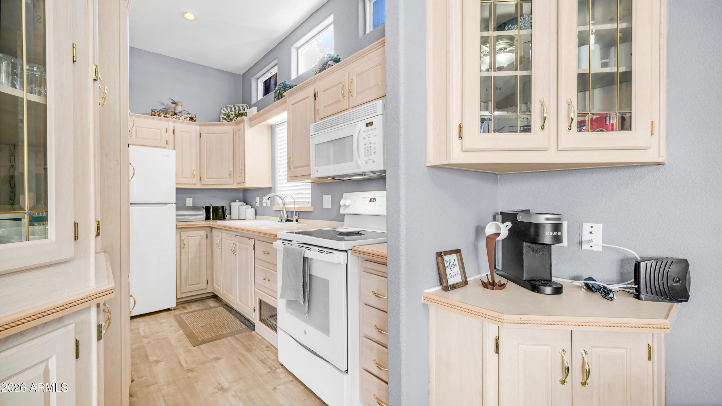 600 South Idaho Road Apache Junction, AZ 85119 - Photo 13 of 63 a kitchen with stainless steel appliances granite countertop a stove and a refrigerator