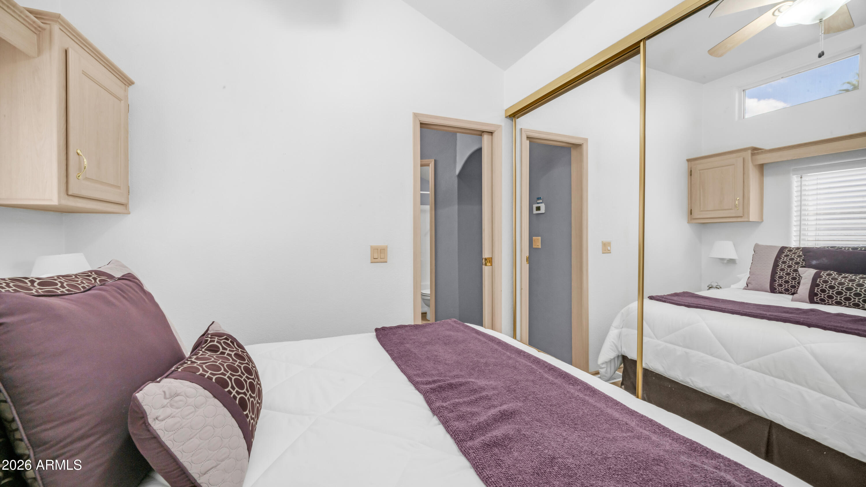 600 South Idaho Road Apache Junction, AZ 85119 - Photo 18 of 63 a bedroom with a bed and a window