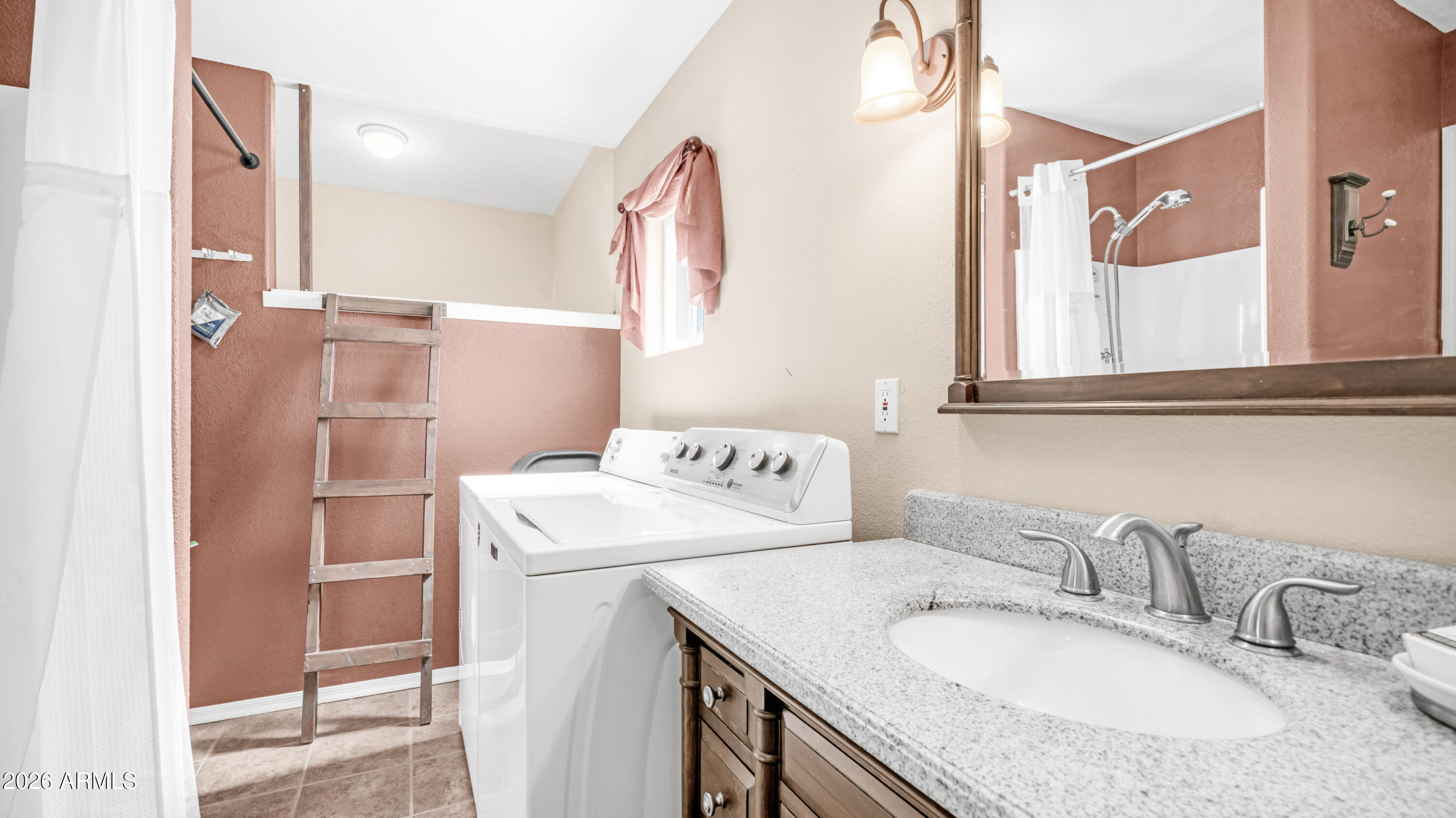 600 South Idaho Road Apache Junction, AZ 85119 - Photo 24 of 63 a bathroom with a granite countertop sink and a mirror