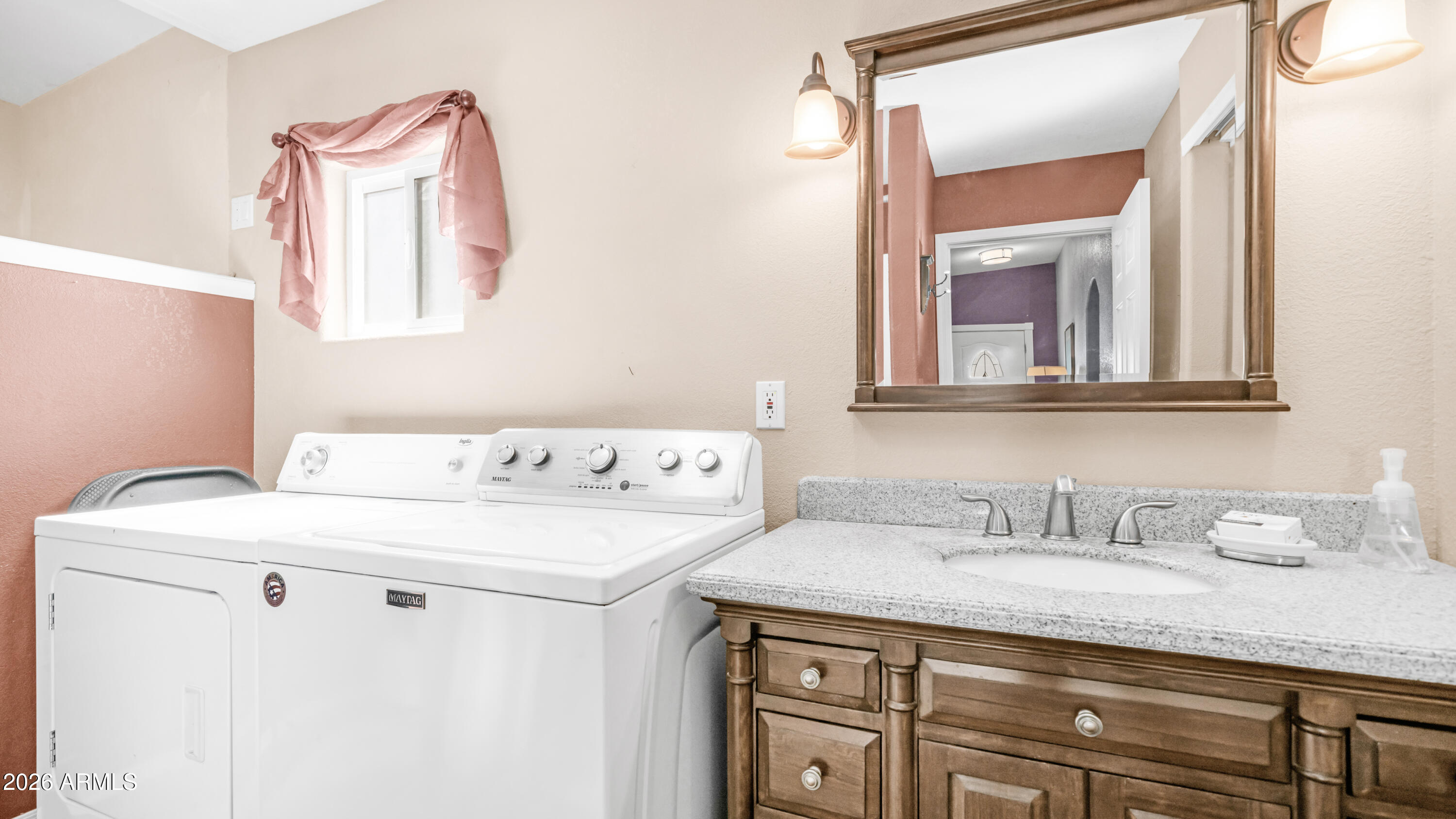 600 South Idaho Road Apache Junction, AZ 85119 - Photo 25 of 63 a bathroom with a sink and a mirror