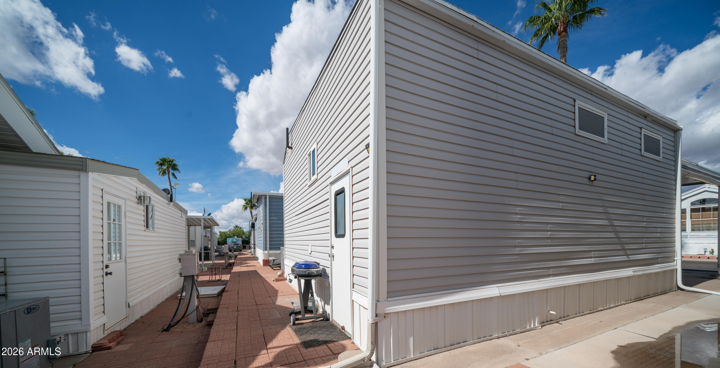 600 South Idaho Road Apache Junction, AZ 85119 - Photo 27 of 63 a view of a house with a patio