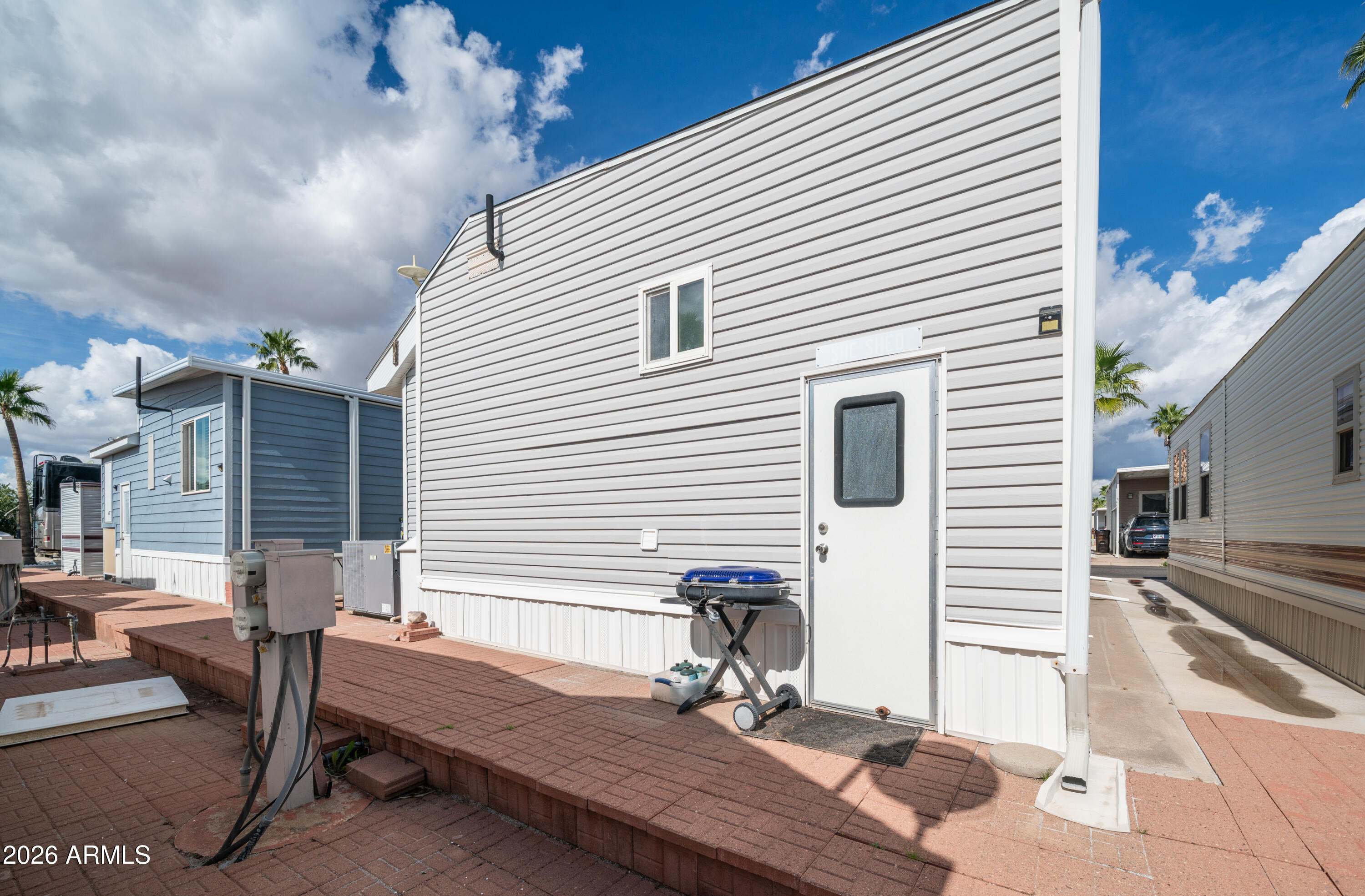 600 South Idaho Road Apache Junction, AZ 85119 - Photo 30 of 63 a view of a patio with table and chairs and potted plants