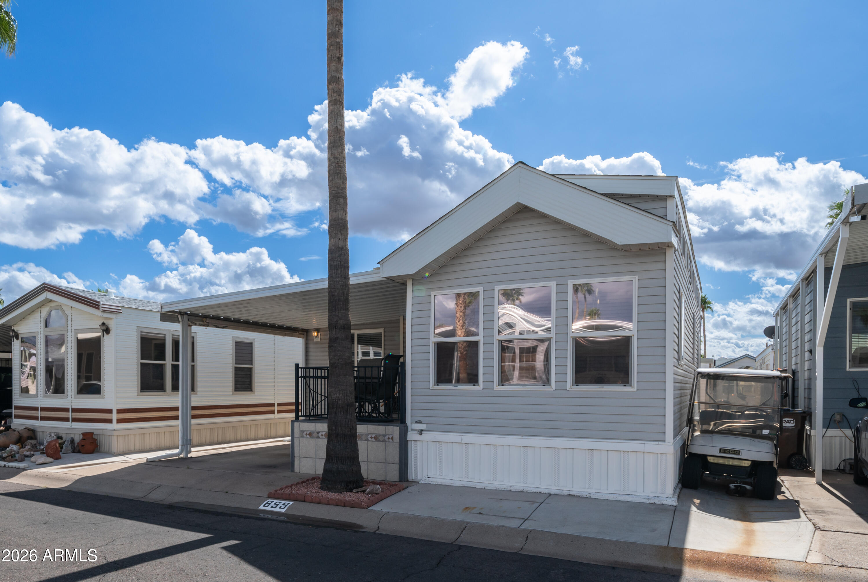 600 South Idaho Road Apache Junction, AZ 85119 - Photo 4 of 63 a front view of a house with a yard