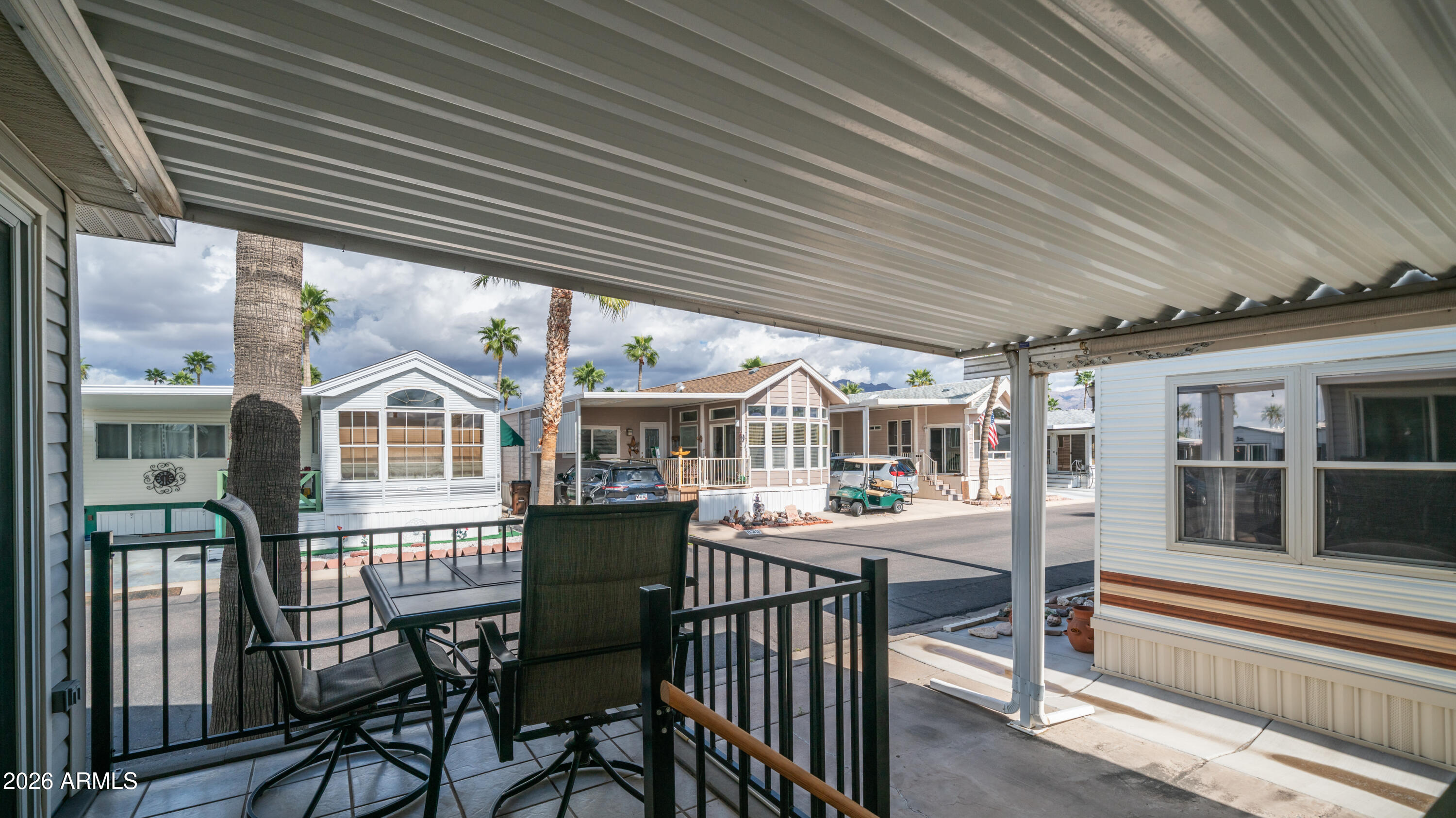 600 South Idaho Road Apache Junction, AZ 85119 - Photo 6 of 63 a view of a house with backyard and sitting area