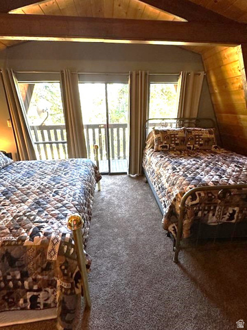 1456 Navajo Road Coalville, UT 84017 - Photo 24 of 55 Carpeted bedroom featuring wood ceiling, vaulted ceiling with beams, access to outside, and ceiling fan
