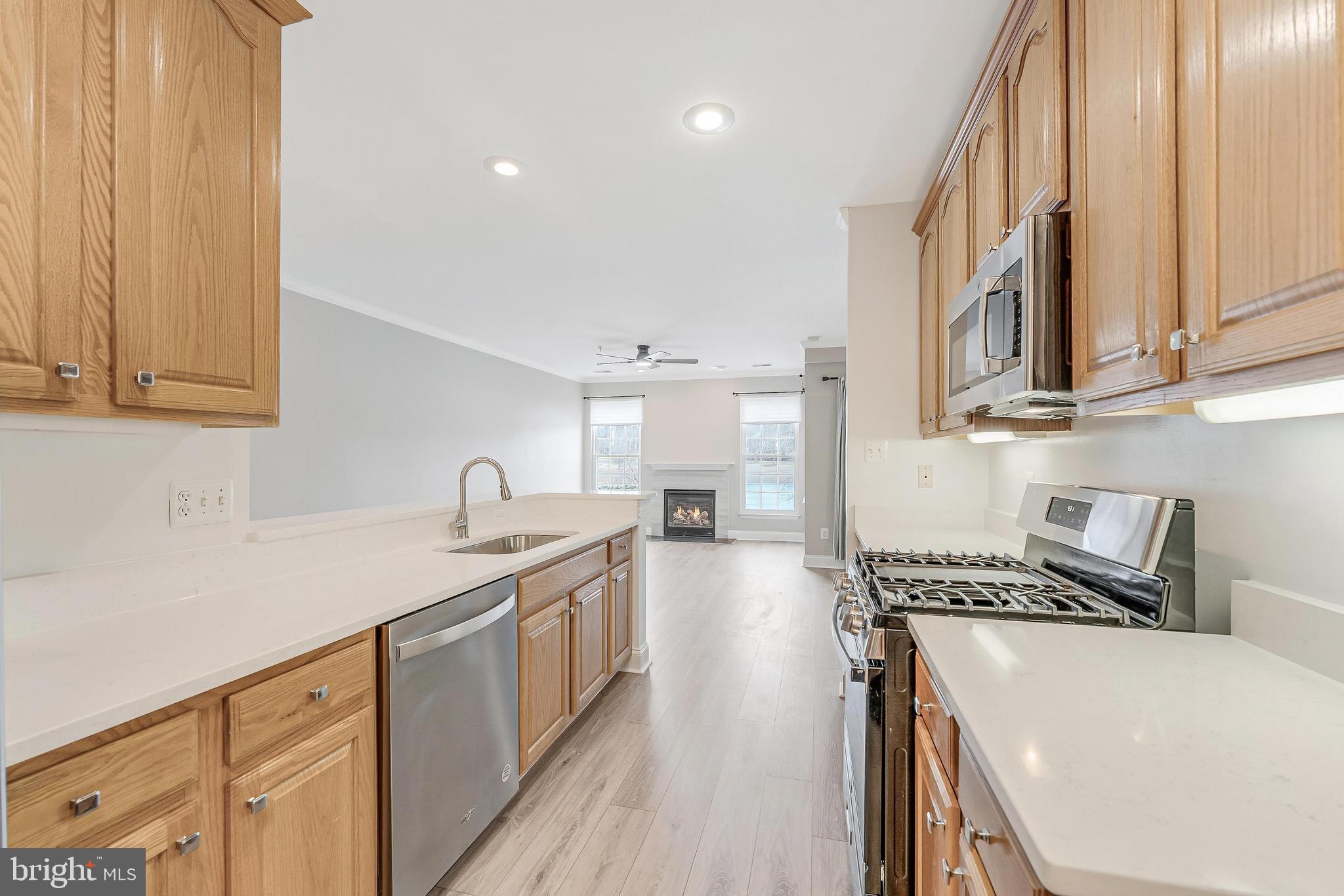 25280 Lake Shore Square, Unit 102 Chantilly, VA 20152 - Photo 16 of 41 a kitchen that has a sink and a stove
