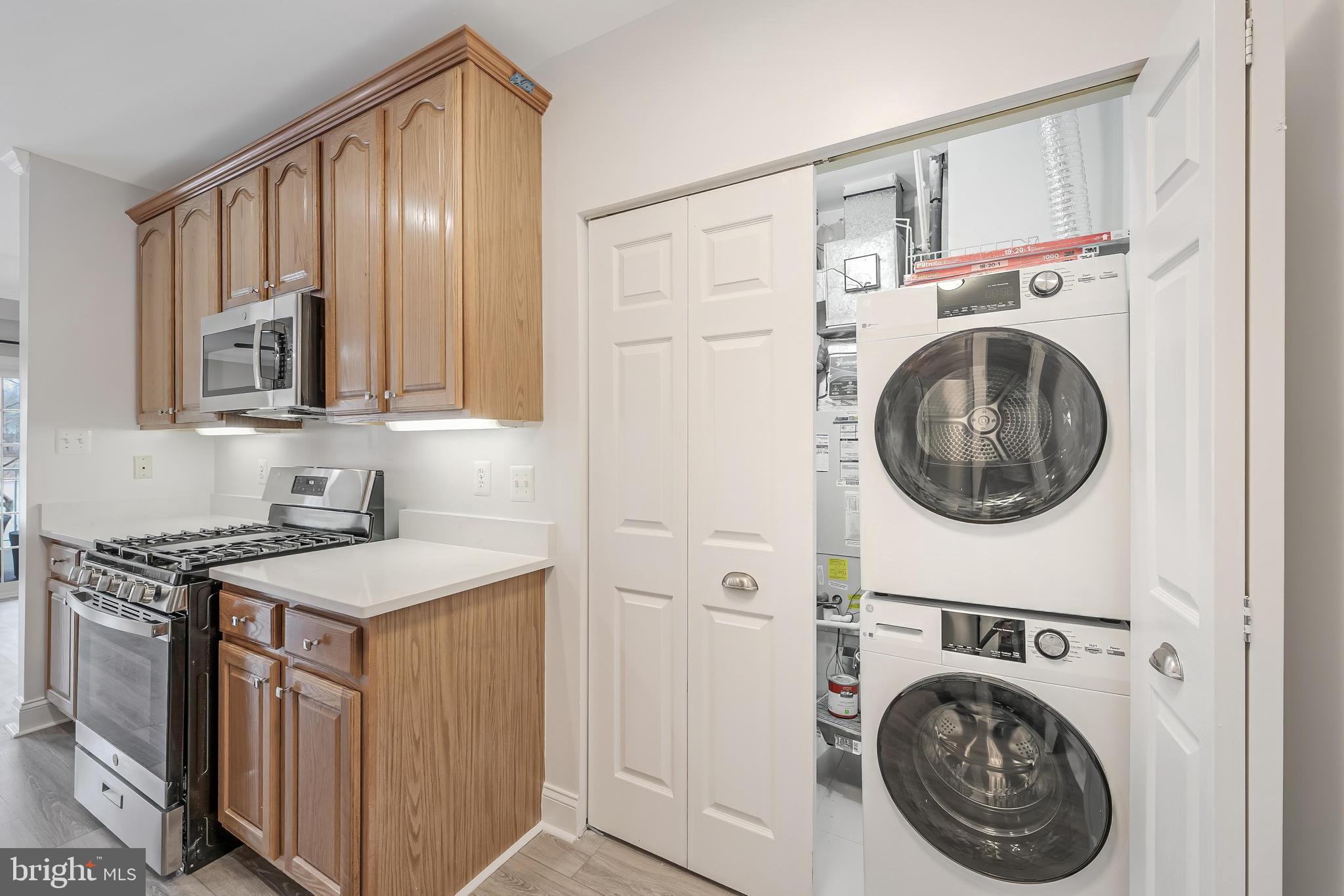 25280 Lake Shore Square, Unit 102 Chantilly, VA 20152 - Photo 18 of 41 a utility room with dryer and washer