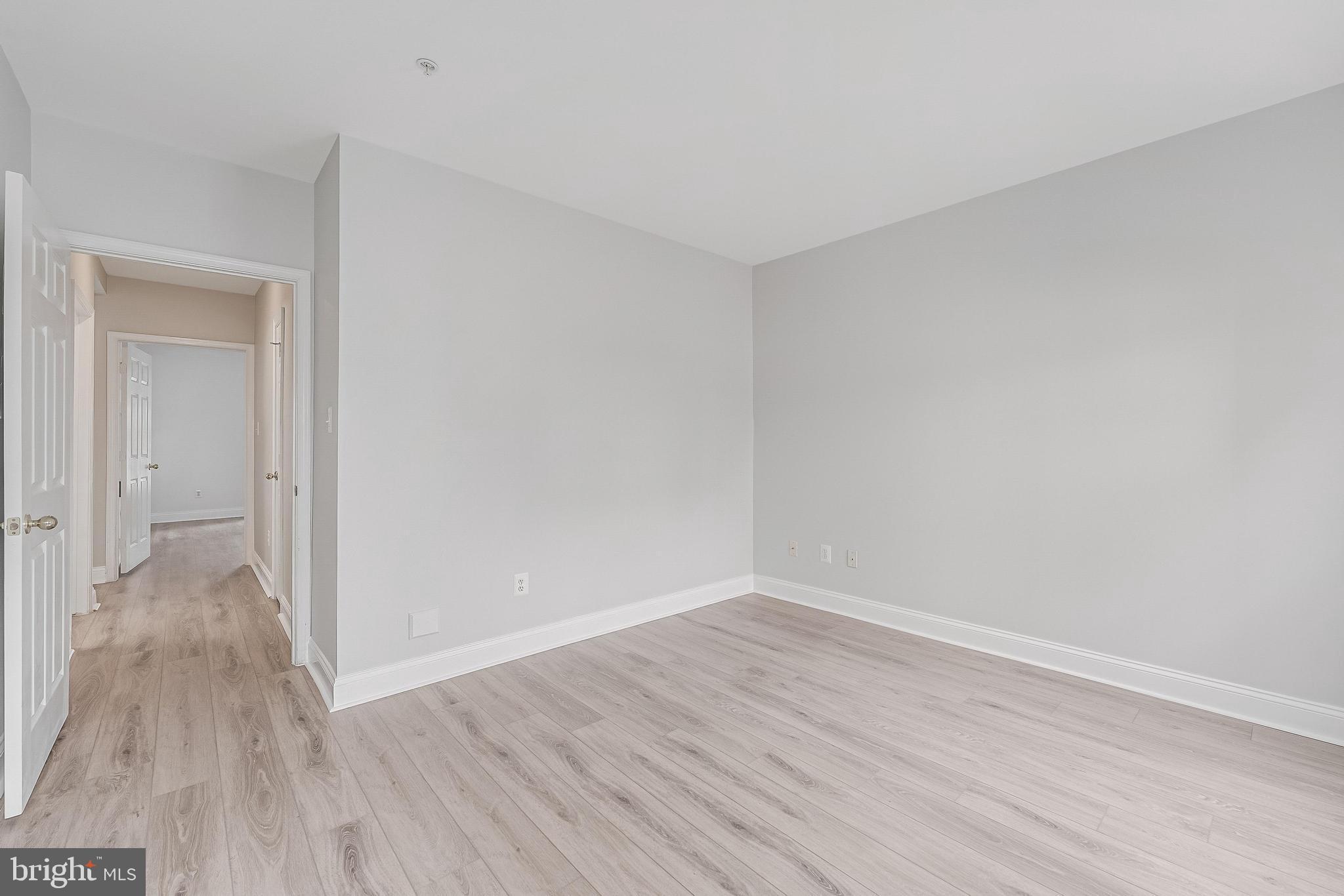 25280 Lake Shore Square, Unit 102 Chantilly, VA 20152 - Photo 21 of 41 a view of a room with wooden floor