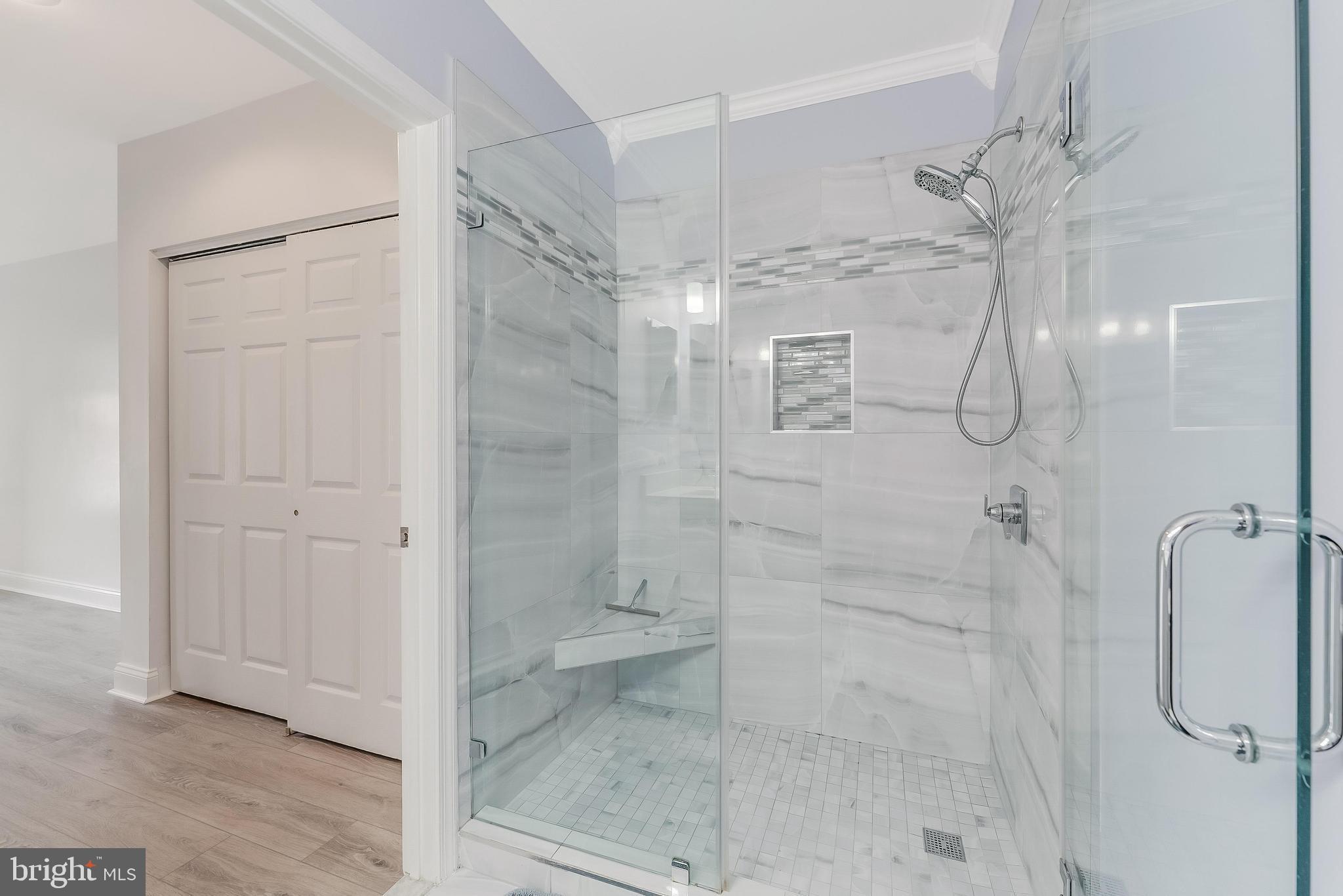 25280 Lake Shore Square, Unit 102 Chantilly, VA 20152 - Photo 28 of 41 a bathroom with a shower