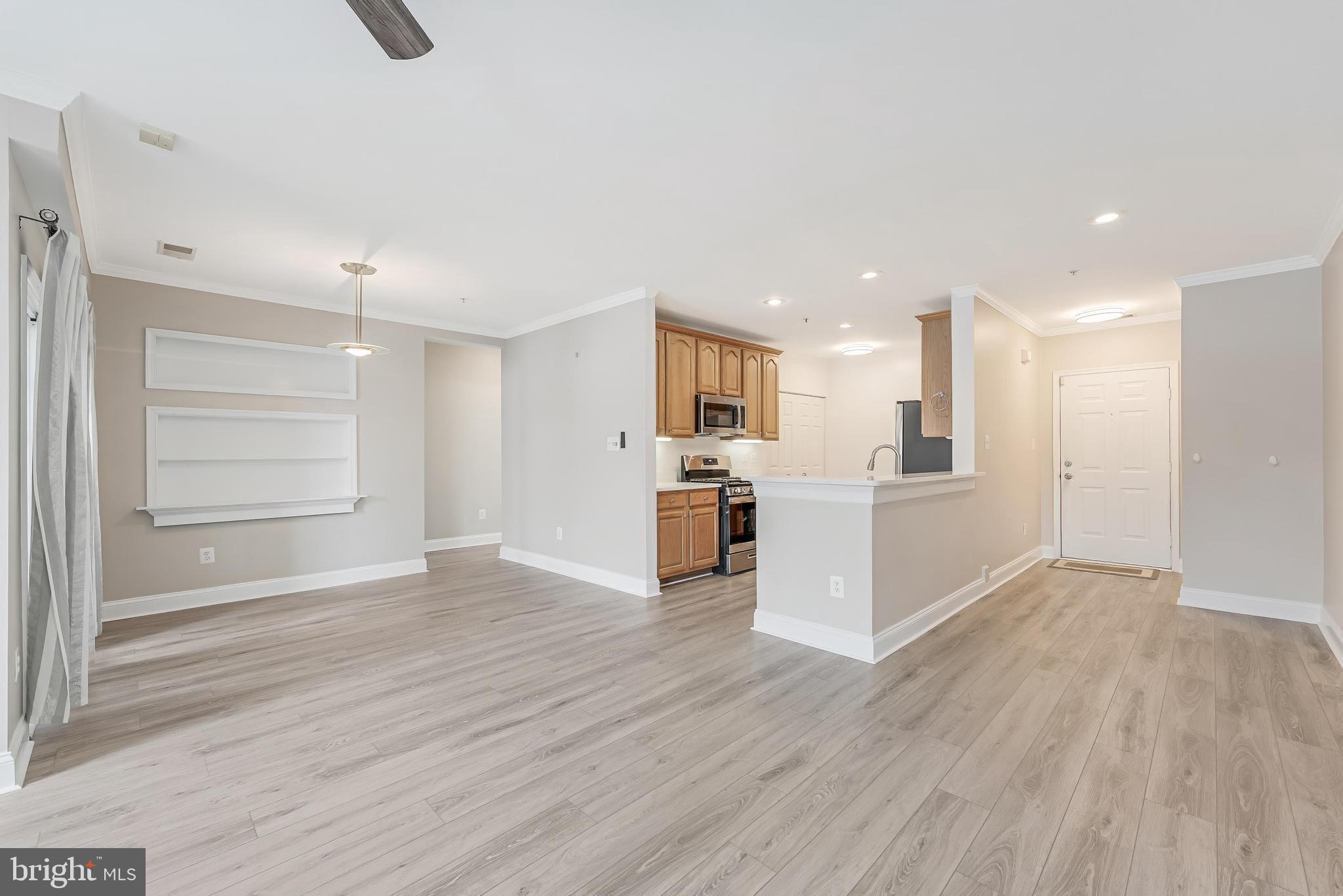 25280 Lake Shore Square, Unit 102 Chantilly, VA 20152 - Photo 8 of 41 a view of large kitchen with wooden floor and windows