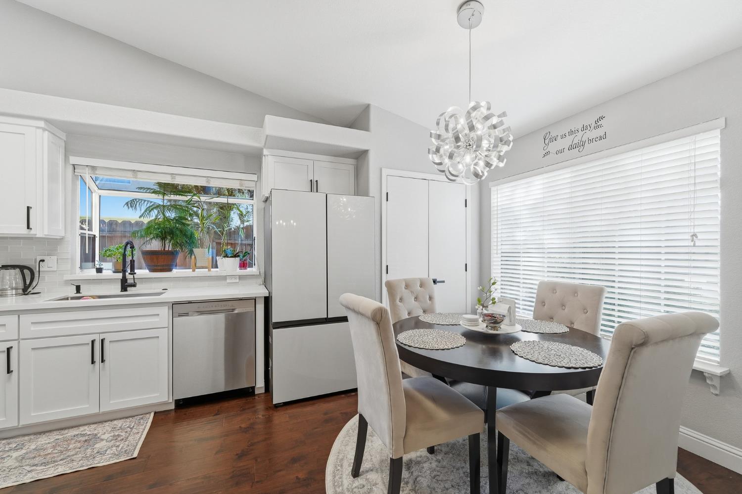 3409 Friar Tuck Way Modesto, CA 95355 - Photo 12 of 46 a view of a dining room with furniture window and wooden floor
