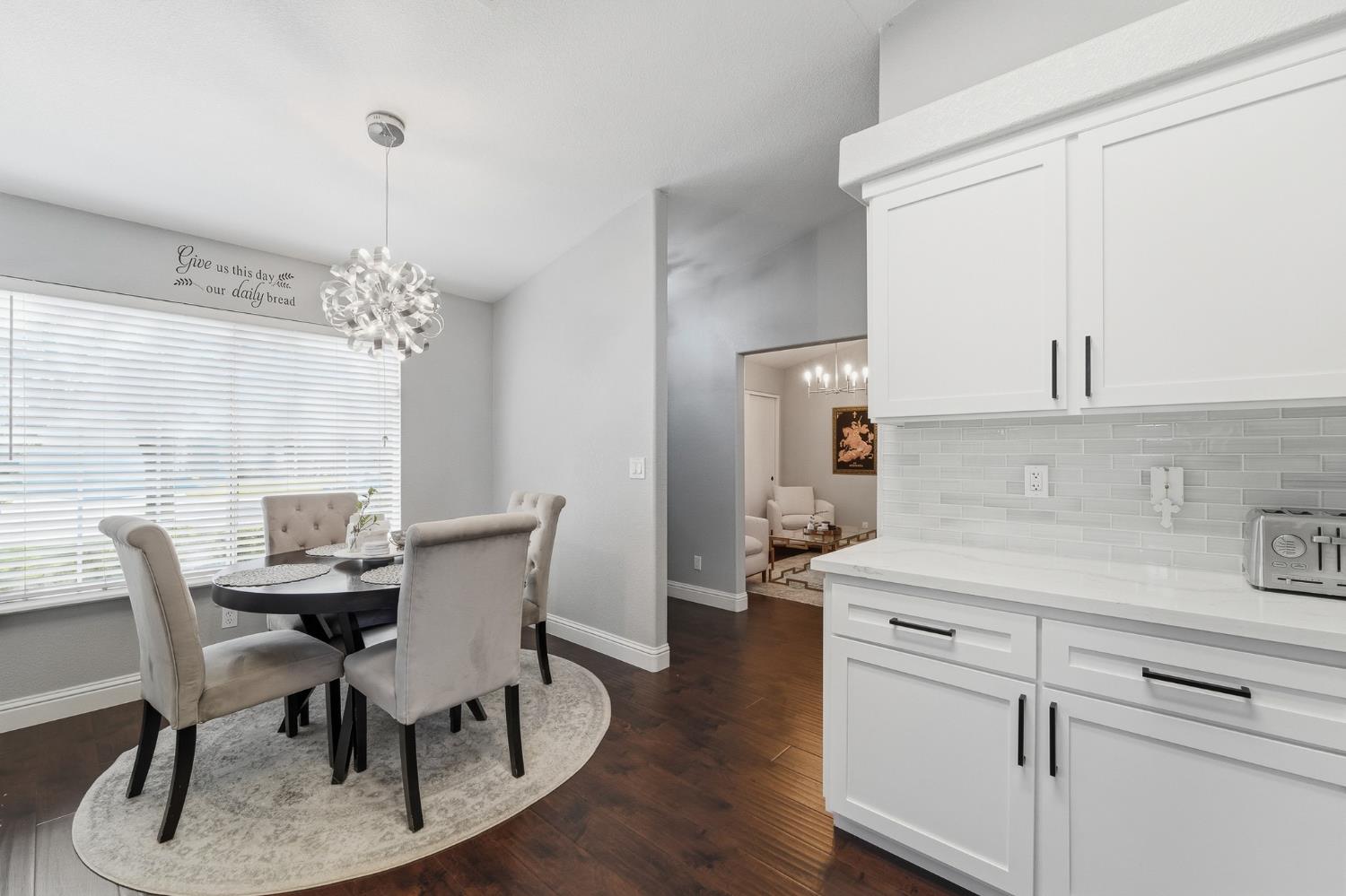 3409 Friar Tuck Way Modesto, CA 95355 - Photo 18 of 46 a view of a dining room with furniture and wooden floor