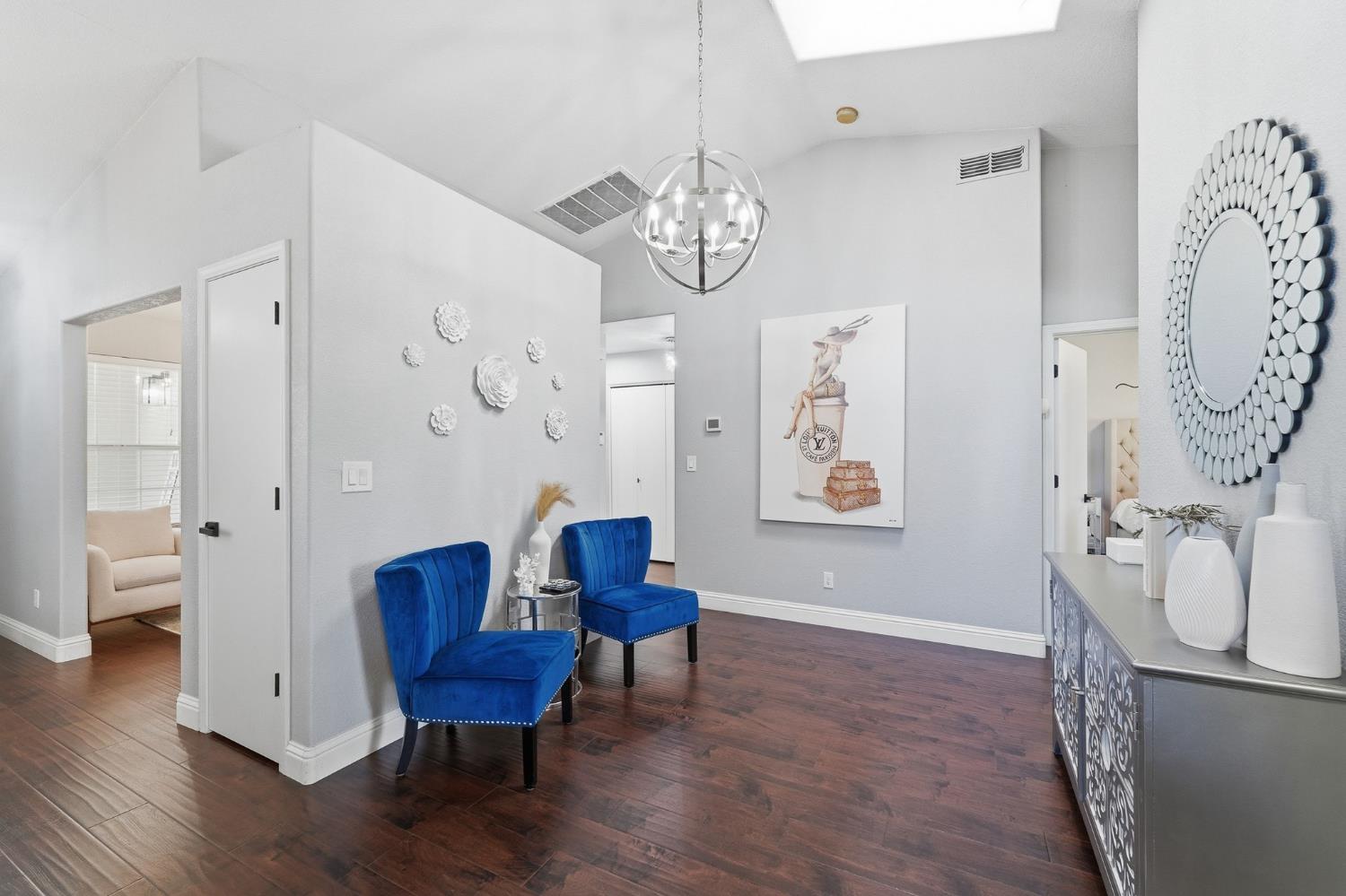 3409 Friar Tuck Way Modesto, CA 95355 - Photo 27 of 46 a view of a livingroom with furniture wooden floor and a chandelier